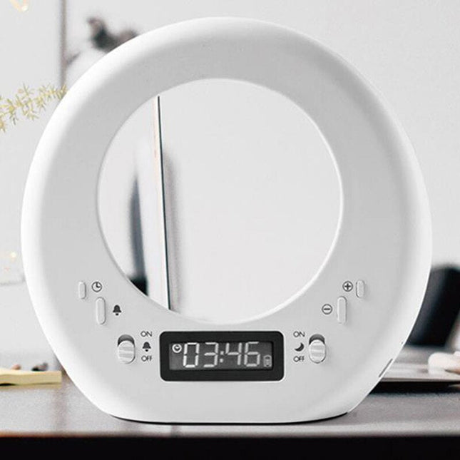 Moderni herätyskello ja kuunvalaisin