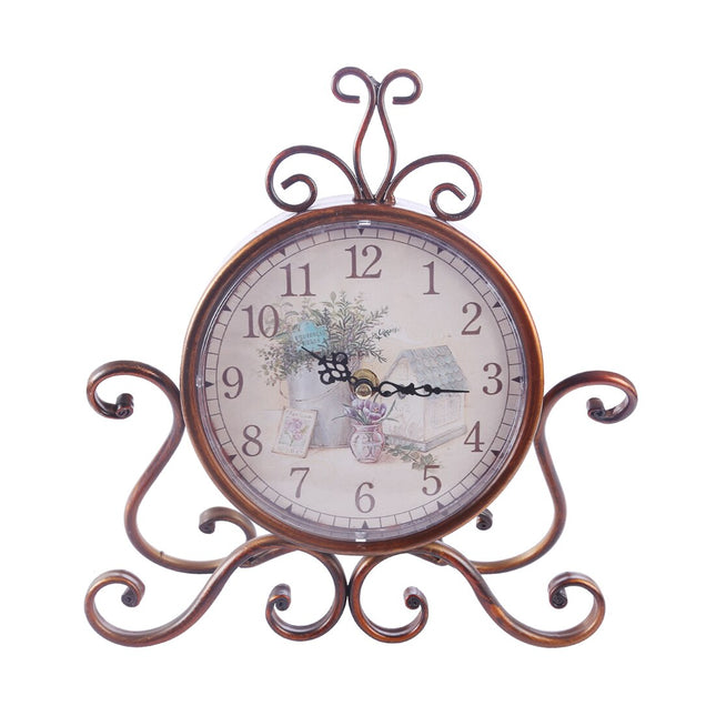 Koristeellinen vintage-pöytäkello metallijalustalla