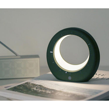 Moderni herätyskello ja kuunvalaisin