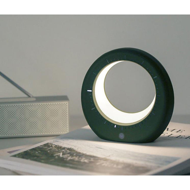 Moderni herätyskello ja kuunvalaisin