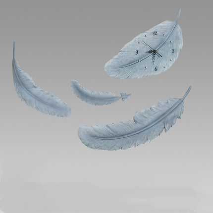 Koristeellinen höyhenen muotoinen seinäkello