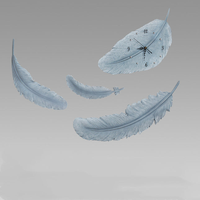 Koristeellinen höyhenen muotoinen seinäkello