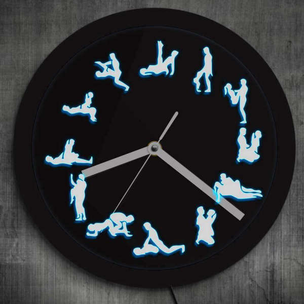 Kamasutra-seinäkello LED-valoilla
