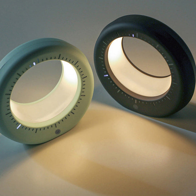 Moderni herätyskello ja kuunvalaisin