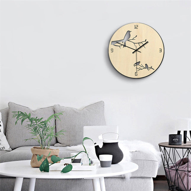 Puinen seinäkello lintu-silueteilla