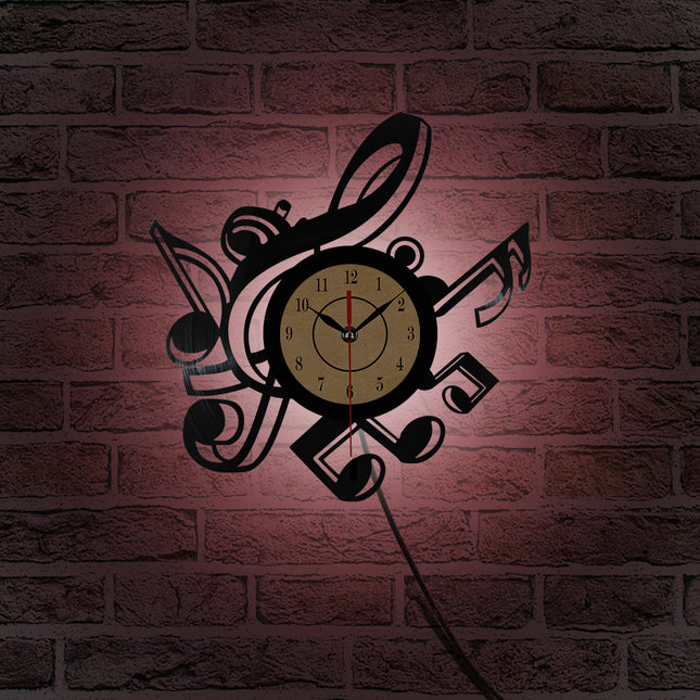 Musiikki vinyylikello nuoteilla