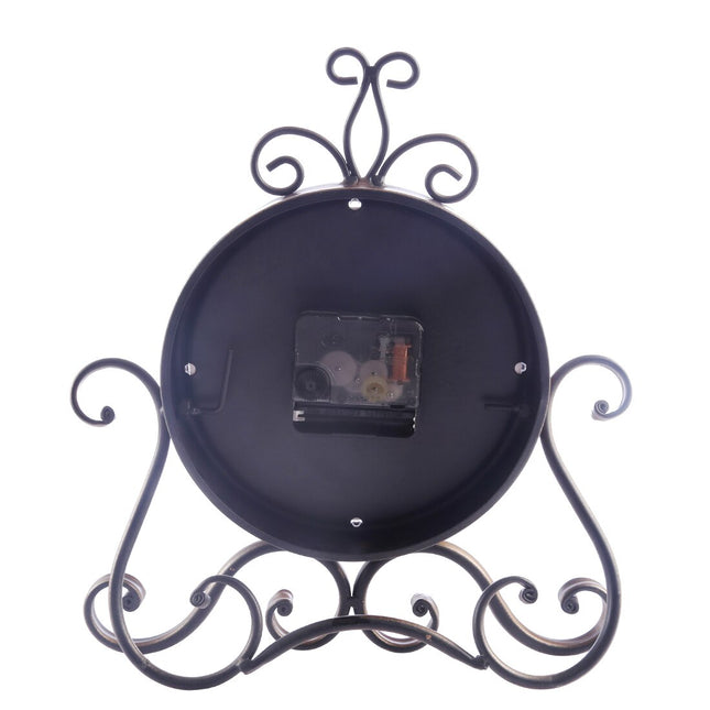 Koristeellinen vintage-pöytäkello metallijalustalla