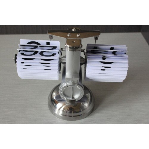 Tasapainovaa'an tyylinen vintage fläppikello