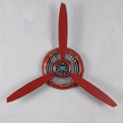 Lentokoneen potkurin muotoinen seinäkello