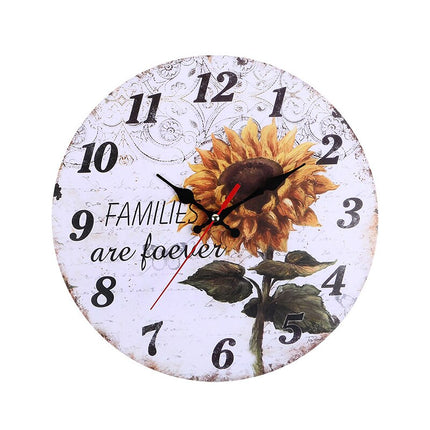 Puinen seinäkello kauniilla auringonkukalla