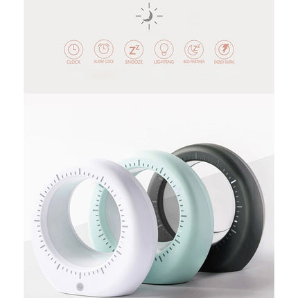 Moderni herätyskello ja kuunvalaisin