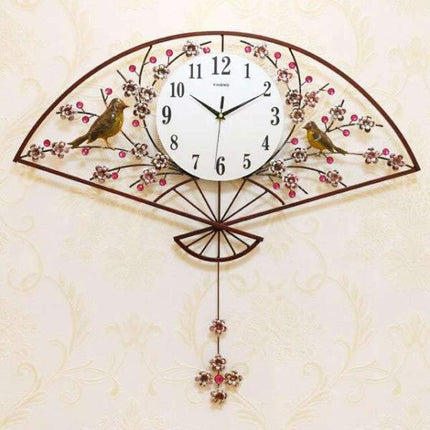 Iso seinäkello viuhka- ja lintuaiheella