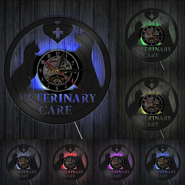 Vinyylilevy-seinäkello eläinlääkärin teemalla